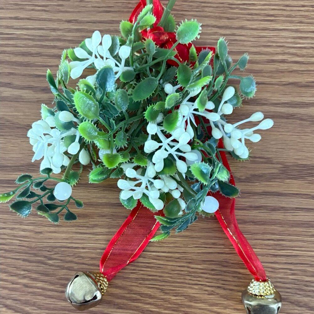 Hanging faux mistletoe ornament with jingle bells and red ribbon